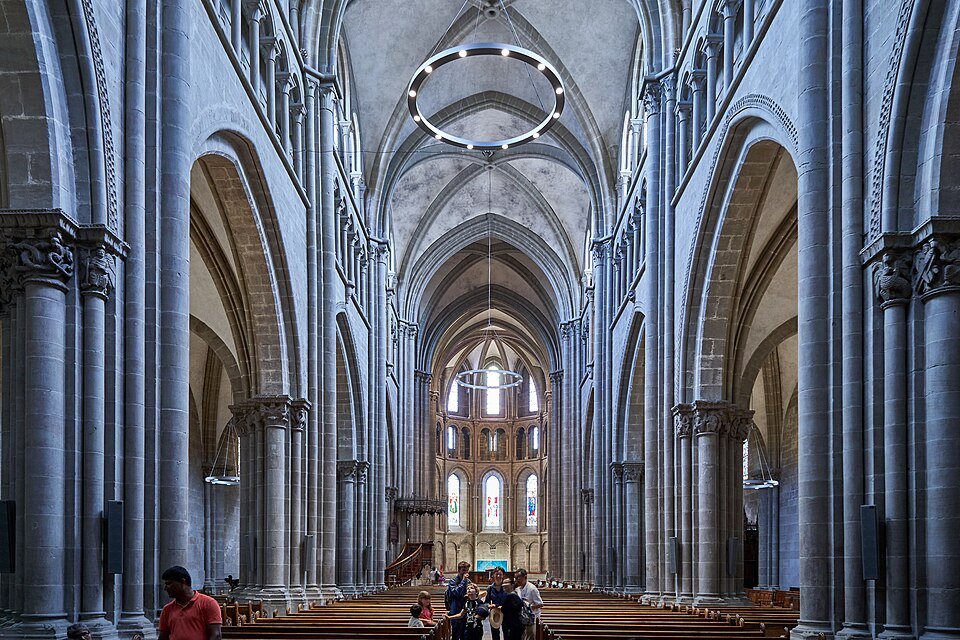 The long Gothic nave of Saint-Pierre Cathedral with its ring chandelier