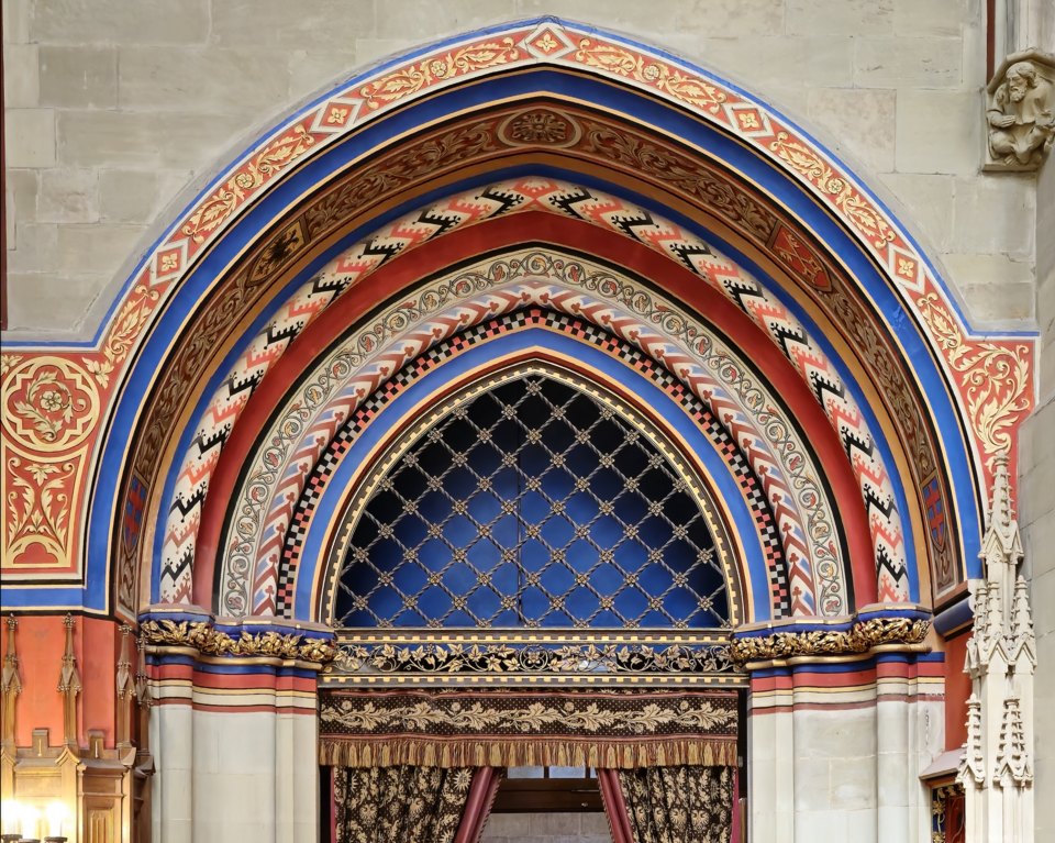 A painted arch of red, blue and gold in the Maccabees Chapel
