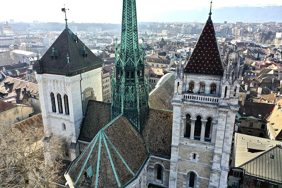 The cathedral's green spire between its two stone towers, above the roofs of the old town