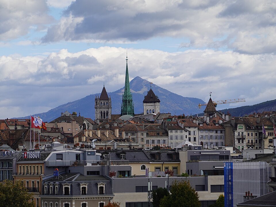 The cathedral's spire and towers above the city, the Salève rising behind