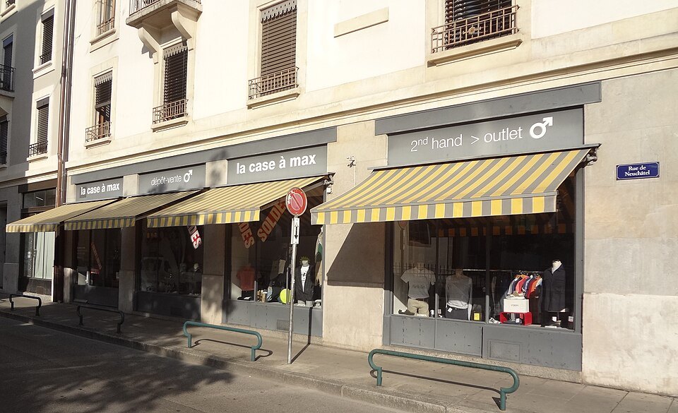 Secondhand shops under striped awnings on the Rue de Neuchâtel