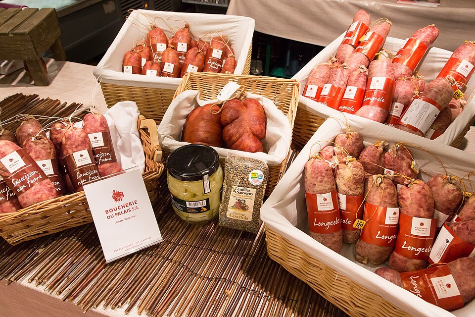 Longeole sausages in baskets on a butcher's counter