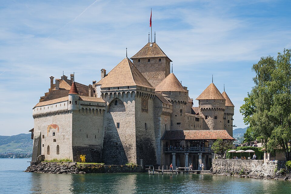 Chillon Castle seen from its pier, the turrets and keep rising from the water