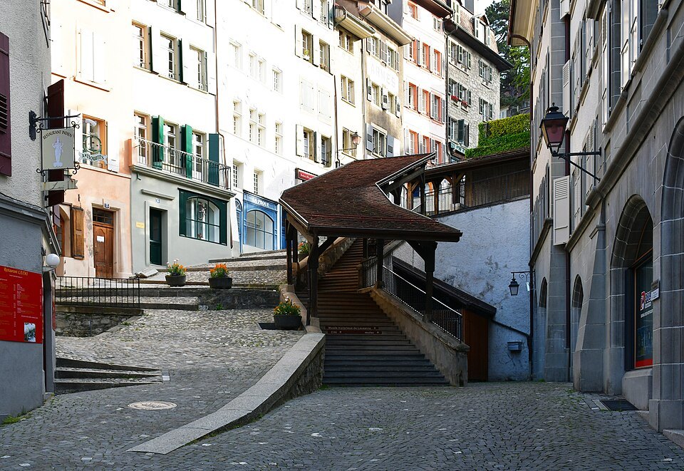 The foot of the covered market stairs in Lausanne's old town
