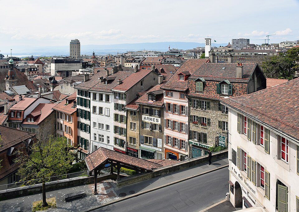 Tiled roofs and old house fronts of Lausanne's old town, the covered stairs below