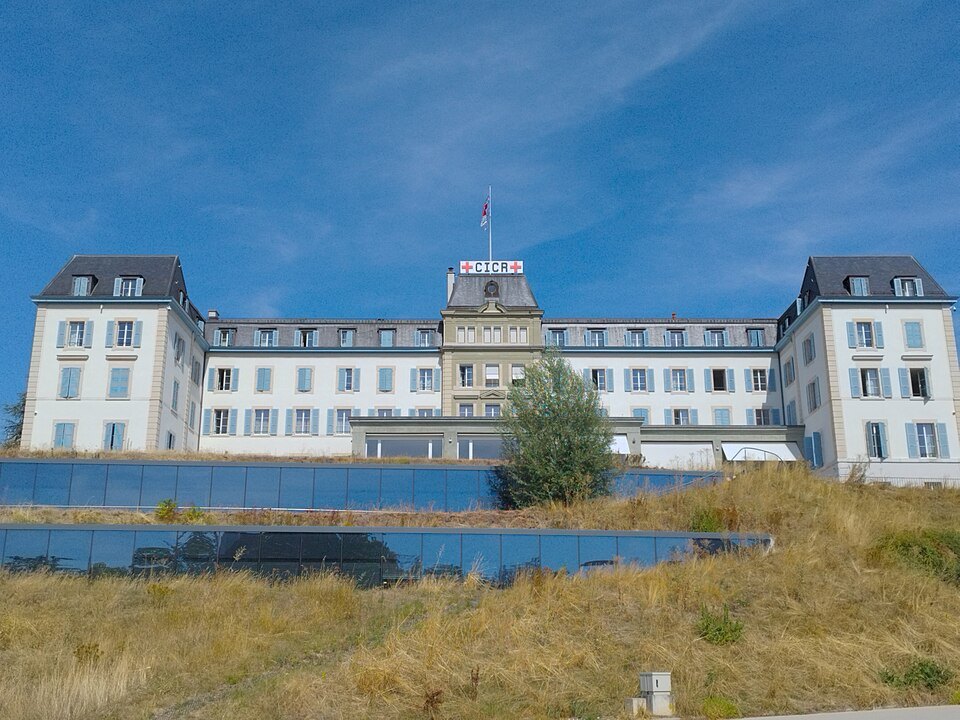 The International Committee of the Red Cross headquarters across a planted slope