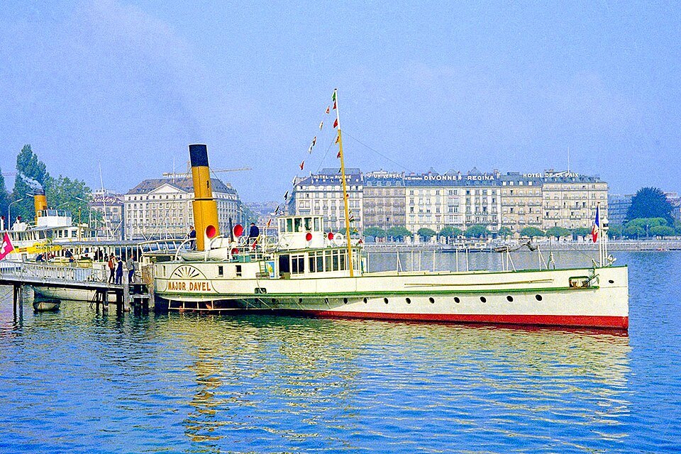 The paddle steamer Major Davel moored in the harbor below the right-bank hotels