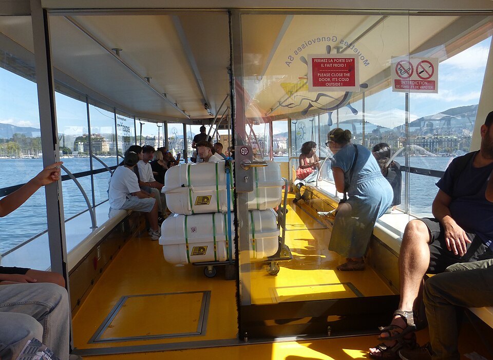 Passengers inside the solar ferry Hélianthe crossing the harbor