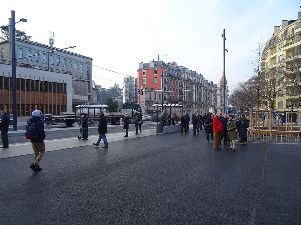 Passengers crossing the square at the Eaux-Vives tram stops