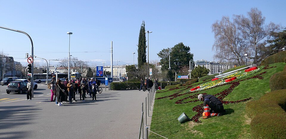 Gardeners replanting the face of the flower clock by the lakefront