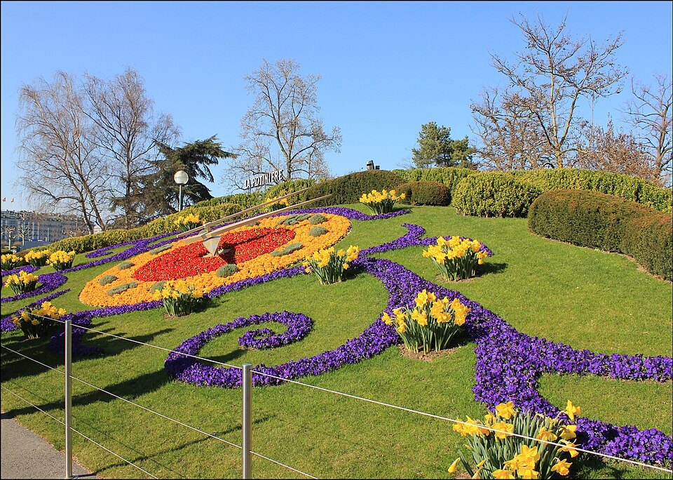 Spring flowers planted in the face of the flower clock in the Jardin Anglais