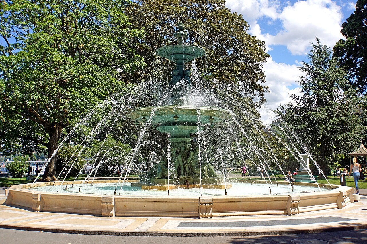 The cast-iron fountain of the Jardin Anglais sending up its jets