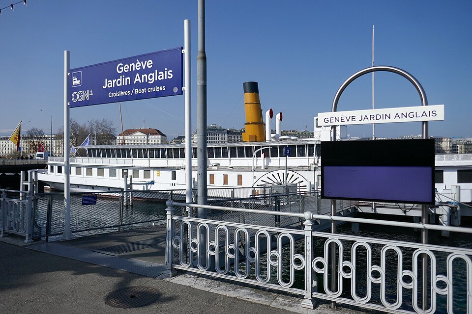The Jardin Anglais landing stage with a paddle steamer moored behind