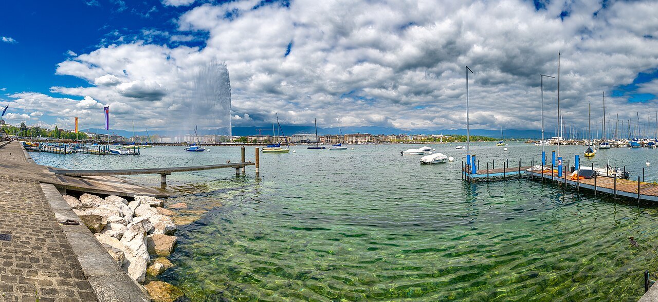 The Jet d'Eau beyond the clear shallows and moorings of the harbor