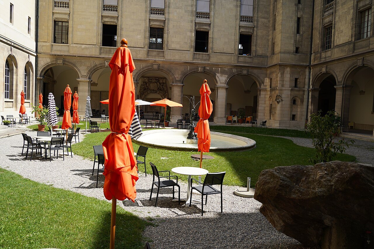 Orange parasols and café tables in the courtyard of the Musée d'Art et d'Histoire