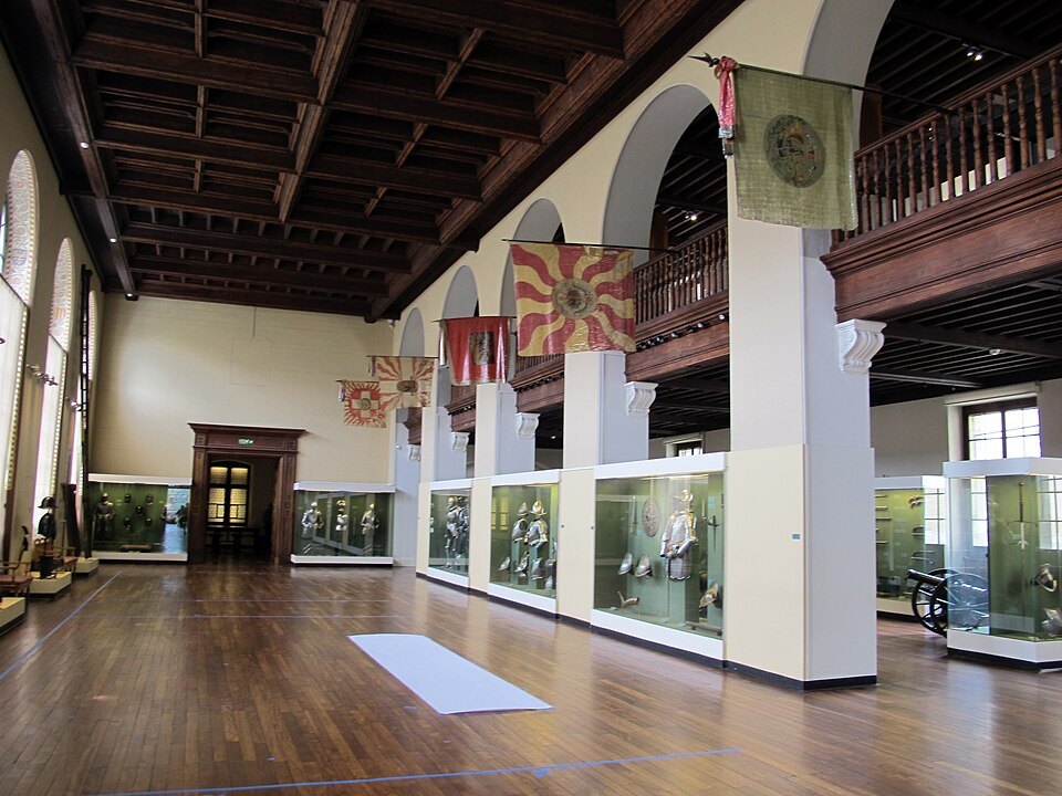 The armory hall with banners hung above the display cases