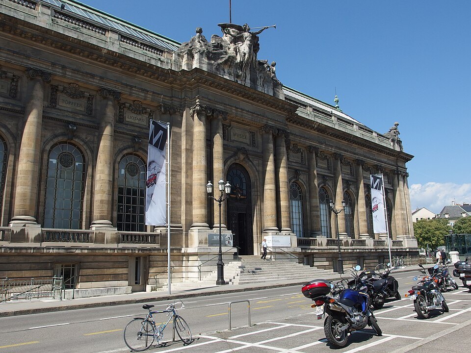 The columned facade of the Musée d'Art et d'Histoire, motorcycles parked below
