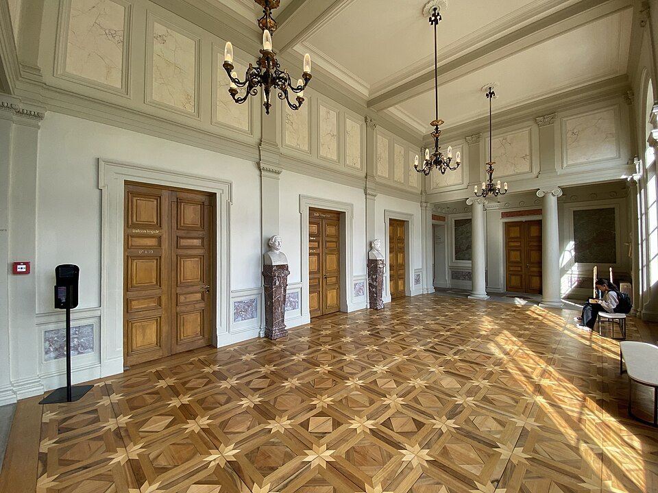 The parquet-floored foyer of the Conservatory of Music with its chandeliers