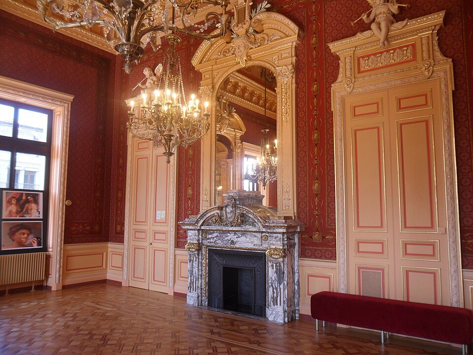 The gilded Petit foyer of the Grand Théâtre with its marble fireplace and chandelier