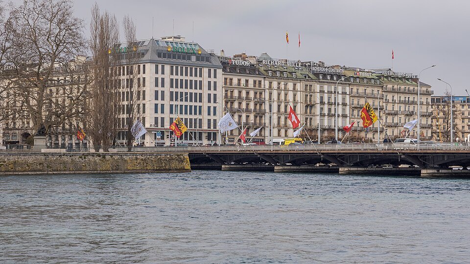 The Pont du Mont-Blanc lined with flags, the Quai du Mont-Blanc hotels behind