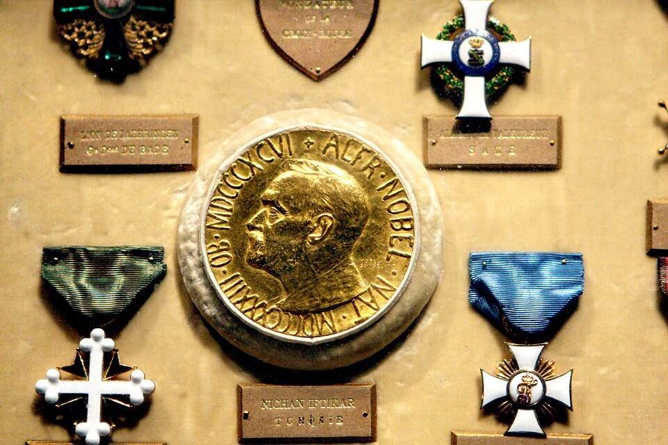 Henry Dunant's Nobel Peace Prize medal among decorations in a museum case