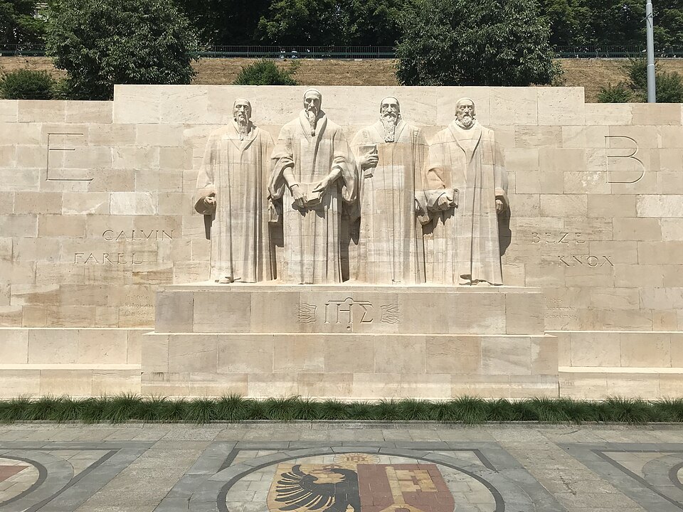 Farel, Calvin, Beza and Knox at the center of the Reformation Wall, with Geneva's arms set in the paving