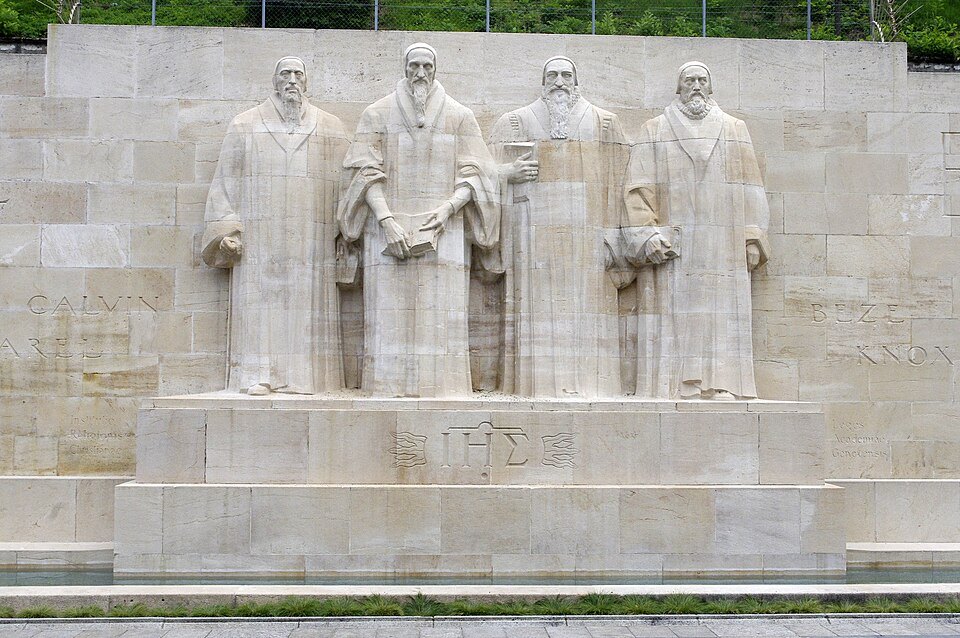 The central figures of the Reformation Wall under a gray sky
